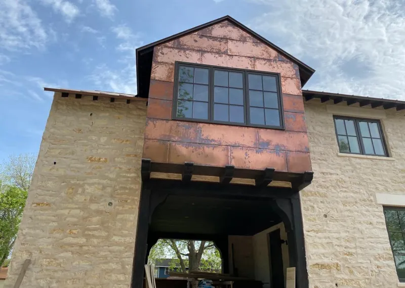 Copper metal panel facade on a stone building for Roof Repair in Gahanna