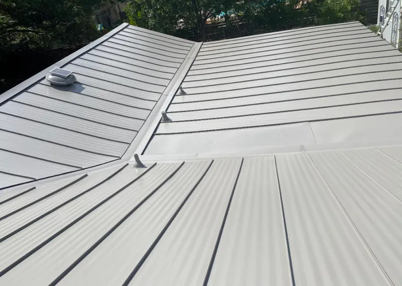Solar attic fan installed on a metal roof for Roof Ventilation in Gahanna